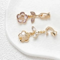 Macro detail of 18k gold plated camellia flower connector with zircon and white enamel - Purple & White Style (No. 3, 18K Gold, Single Item Price)