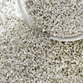 Macro shot of silver cylindrical glass seed beads for DIY jewelry and embroidery crafts - Style 1