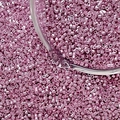 Macro shot of pink metallic cylindrical glass seed beads in a transparent glass container - Style 4