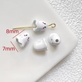 Macro view of 8mm white ghost charms for DIY jewelry with pink blush details - White Ghost Loose Bead (8x7mm)