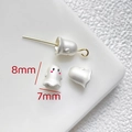 Macro shot of 8x7mm matte white ghost charm beads with pink cheeks for DIY jewelry making - Matte White Ghost Bead (8x7mm)