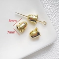 Macro detail of 8mm x 7mm gold ghost beads showing precise enamel eyes for DIY jewelry - Gold Electroplated Ghost Bead (8x7mm)