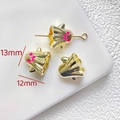 Close-up of 13x12mm ghost-shaped gold beads with pink enamel for DIY jewelry making - Gold Ghost with Hat Bead (13x12mm)