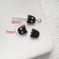 Macro shot of three small black cat charms showing 9mm by 7mm dimensions for jewelry DIY - Black Cat Shape Bead (9x7mm)