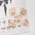 Close-up of five delicate pink and yellow gradient glass butterfly pendants for jewelry - Pink Yellow Gradient Butterfly Style (D4422-3)