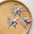 Detail view of butterfly DIY charm with Chinese calligraphy and 29mm size mark - 9# Calligraphy Art