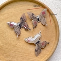 Macro detail of acrylic butterfly pendants with ink painting and calligraphy design - 7# Retro Warm Tone