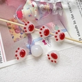 Detailed view of six cute cat paw beads in white and red for DIY jewelry making - 10 Pieces Pack / Bright Red