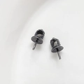 Macro detail of glossy black 18k gold plated metal bead caps for DIY jewelry crafts - Gun Black Style