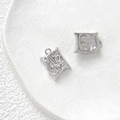 Close-up of irregular textured silver pendants with lava pattern and top metal rings - Rectangle Texture Shape / White Gold