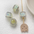 Détail de quatre perles cylindriques en cristal AB avec strass jaunes pour bijoux DIY - Jaune Pâle Style 7
