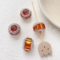 Gros plan de perles de cristal facettées rouges et orange avec strass pour bijoux DIY - Rouge Orangé Style 8