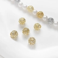 Gros plan de perles géométriques creuses plaquées or 14 carats pour bijoux - Grand / Or 14 carats