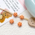 Close-up of four orange resin flower beads for DIY jewelry making on a creative background - Orange Flower (22#)