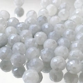 Macro shot of 9mm faceted milky white glass beads for DIY jewelry making and bracelets - Cream