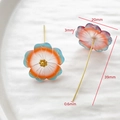 Macro view of handmade floral pins with gradient resin petals and long golden needles - Orange Blue Gradient Flower Ear Wire Style (AP0400)