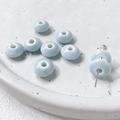 Detailed macro view of light blue glazed ceramic donut beads for jewelry making - Light Blue (3#)