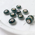Macro detail of handmade vintage floral ceramic beads with deep teal glaze and eye patterns - Dark Cyan Texture (7#)