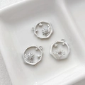 Detailed view of three 14k gold plated Little Prince pendants with sun and star motifs - Platinum Plated Sun Star Style