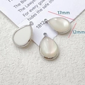 Macro view of teardrop alloy pendants with white shell inlay for DIY jewelry making - Teardrop Inlaid Style