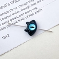 Detailed close-up of a black cat bead featuring a blue devil eye for jewelry making - 11# Black Single Eye Monster (D4171)