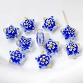 Macro view of blue star-shaped lampwork glass beads with white floral patterns - 1 Piece/Pack / 5# Dark Blue Floral