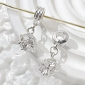 Macro detail of silver hollow cage pendant charm with sparkling cubic zirconia stone inlay - Style 1 (Clear Rhinestone)