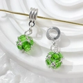 Macro shot of silver zircon pavé pendants with emerald green gemstone beads for jewelry making - Style 5 (Emerald Green Rhinestone)