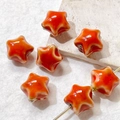Macro shot of orange ceramic star beads with glazed finish and hole for DIY jewelry - Orange Red (4#)