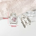 Detailed macro view of silver handbag charm with pink heart zircon and size markings - Handbag Style - Pink (7#)