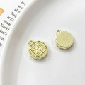 Macro detail of gold mooncake charms showing delicate patterns and circular hanging loops - Universal Specification / Gold Flower Moon Full Mooncake (2#)