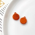 Detail of orange rabbit mooncake pendant with Fu character on white ceramic tray - Universal Specification / Orange Red Fu Character Mooncake (9#)