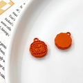 Detailed close-up of orange mooncake charms with floral patterns and hanging loops - Universal Specification / Orange Red Flower Moon Full Mooncake (10#)