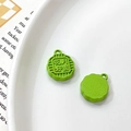 Detailed macro view of grass green mooncake pendant with floral pattern and circular loop - Universal Specification / Grass Green Flower Moon Full Mooncake (14#)
