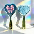 Close-up of heart-shaped air cushion combs with pink plaid bow and rainbow light effect - Pink Checkered Bow Style (A)
