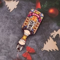 Detail of a red massage hairbrush with festive Chinese New Year graphics and gift decor - Fortune Goddess Illustration (A)