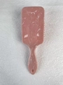 Square paddle brush with marble pattern in rose pink on white textured background - Plain Pink Marble