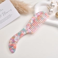 Elegante haarkam van acetaat met grove tanden, marmerpatroon en lange ergonomische handgreep - Rode Print