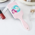 Detailed view of pink mermaid paddle brush with soft bristles and cute cartoon artwork - Pink Mermaid Pattern