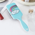 Detail of blue rectangular cushion brush with rainbow cloud cartoon pattern on white desk - Sky Blue Cloud Rainbow Pattern