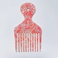 Detailed view of the pink marble cellulose acetate hair pick with wide teeth and hanging hole - Pink Snowflake