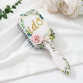 Detail of square air cushion hairbrush with floral pattern and golden i do print - Customizable Pattern / White Base Gold Ido