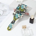 Detalle del cepillo para el cabello vintage con estampados de girasoles y mariposas - Patrón Personalizable / Mariposa