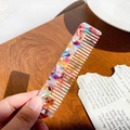 Portable acetate hair comb featuring a colorful marble leopard print texture and fine teeth - Multicolor