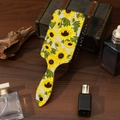 Detailed view of sunflower print hairbrush on vintage wood surface with cushion design - Impressionist Sunflower