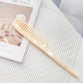 Amber marble acetate hair comb with pointed tail for sectioning and anti-static styling - Off White