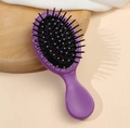 Mini portable purple boar bristle cushion hair brush with soft touch finish for massage - Purple