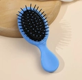 Portable sky blue cushion hair brush with boar bristles and massage tips for smooth hair - Blue