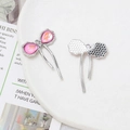 Detailed view of silver bow-shaped pendant with pink teardrop stones and hanging loop - Pink Teardrop Stone Bow (2# Silver Tone)