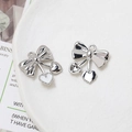 Macro detail of silver bow pendants with white enamel hearts for DIY jewelry - White Enamel Heart Bow (4# Silver Tone)